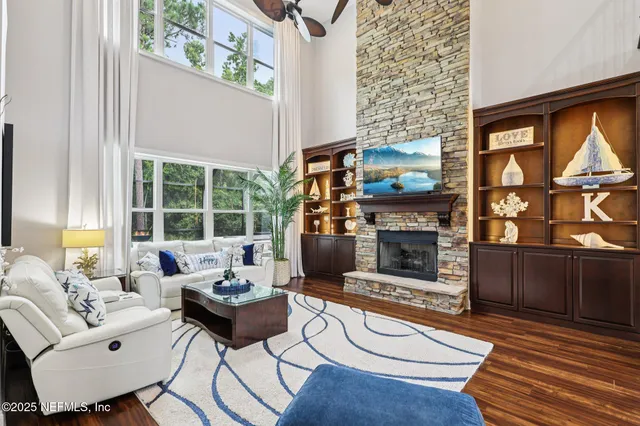 a living room with furniture and a fireplace