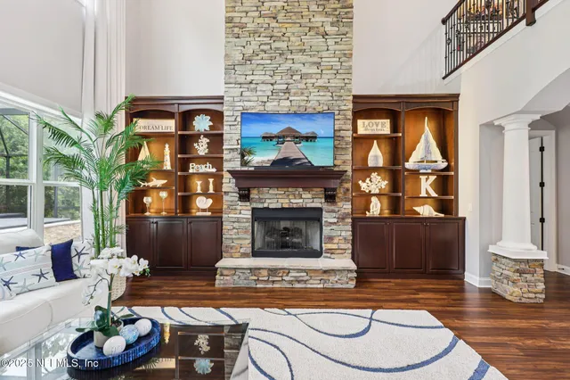 a dining room filled with lots of furniture and window