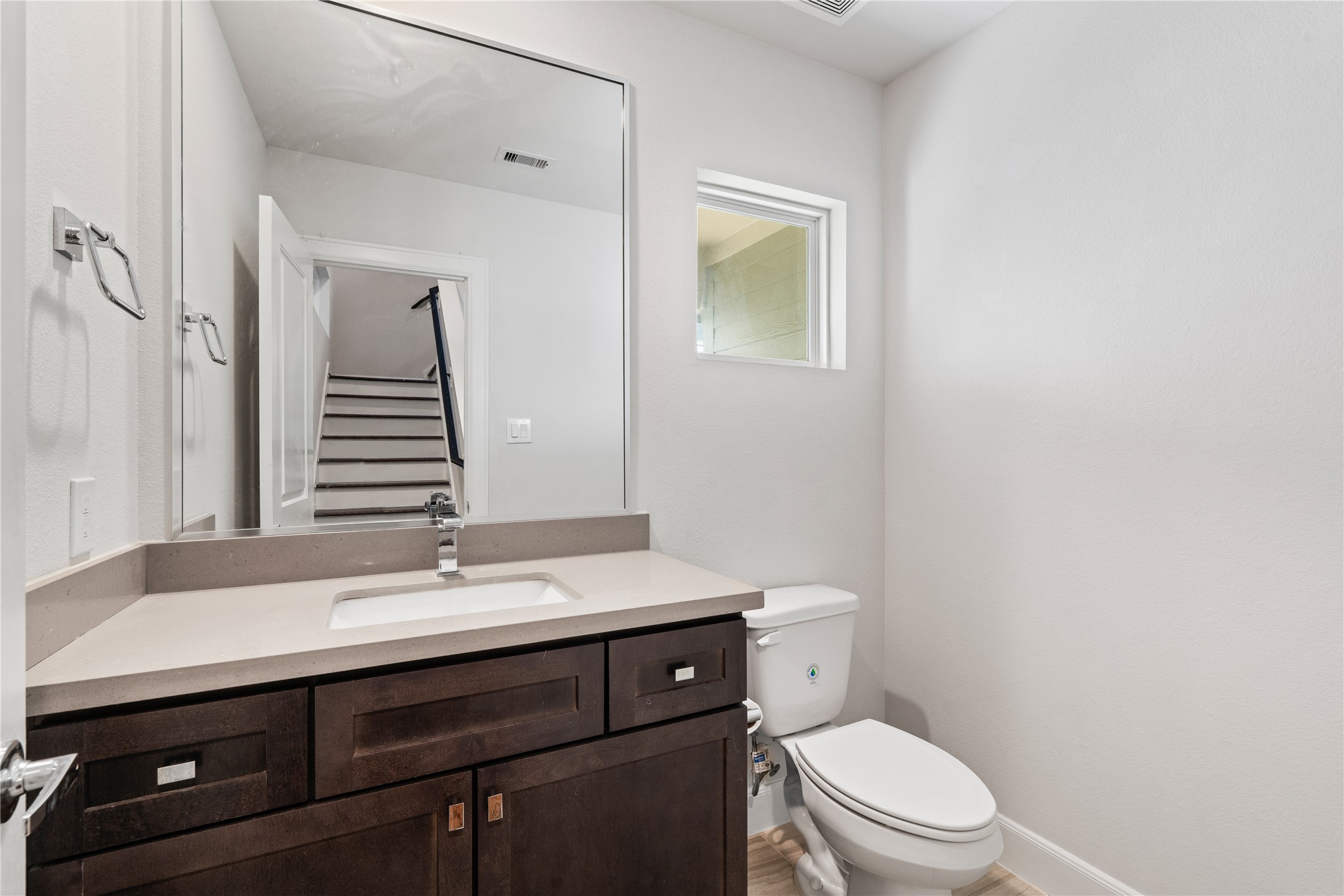 1013 West 17th Street Houston, TX 77008 - Photo 15 of 26 a bathroom with a sink a toilet and mirror