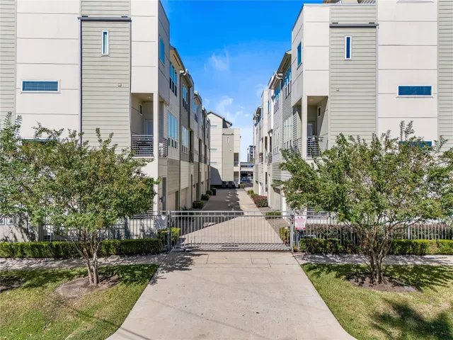 a view of a white building among the street