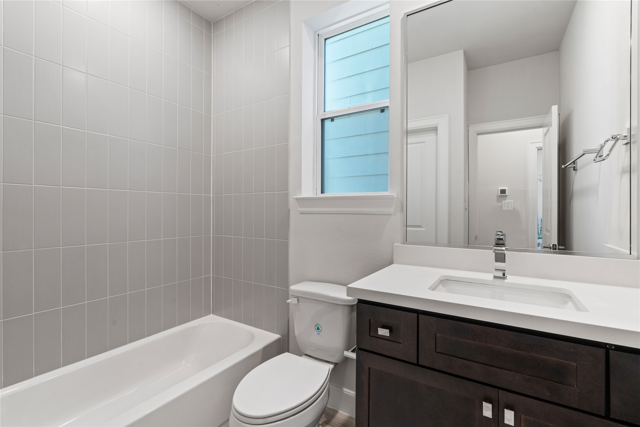 1013 West 17th Street Houston, TX 77008 - Photo 22 of 26 a bathroom with a sink a toilet and shower