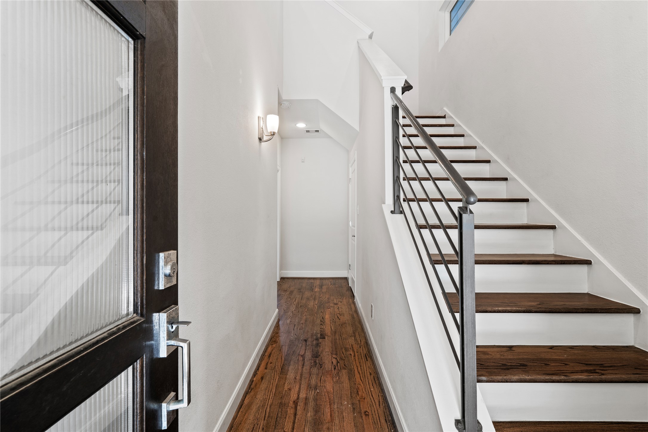 1013 West 17th Street Houston, TX 77008 - Photo 4 of 26 a view of a hallway with wooden floor and staircase