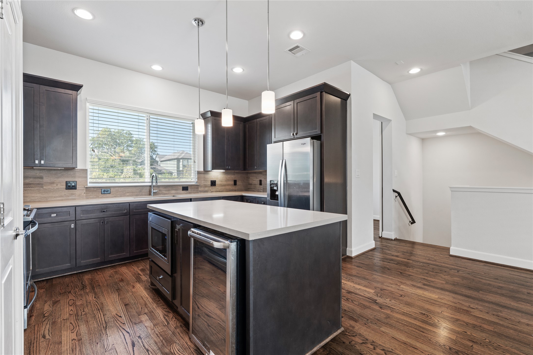 1013 West 17th Street Houston, TX 77008 - Photo 9 of 26 a kitchen with stainless steel appliances granite countertop a sink stove and refrigerator