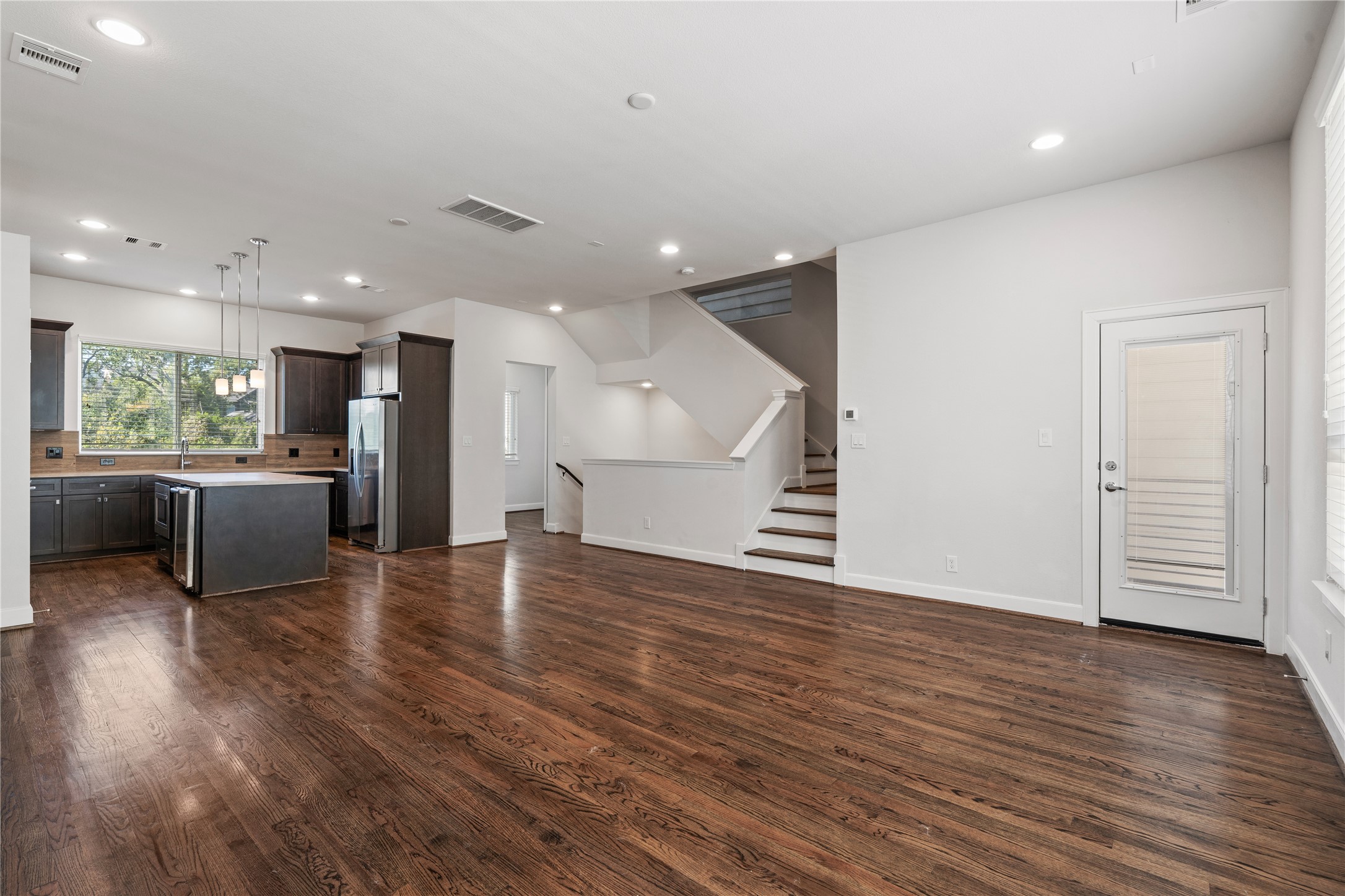 1013 West 17th Street Houston, TX 77008 - Photo 10 of 26 an open kitchen with a refrigerator and a stove top oven