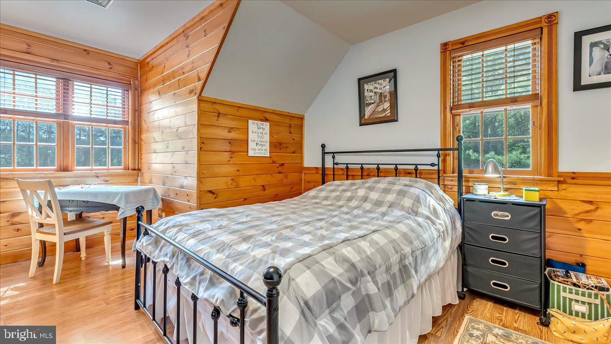 172 Golf Course Road Sugarloaf, PA 18249 - Photo 11 of 23 a bedroom with a bed and wooden floor