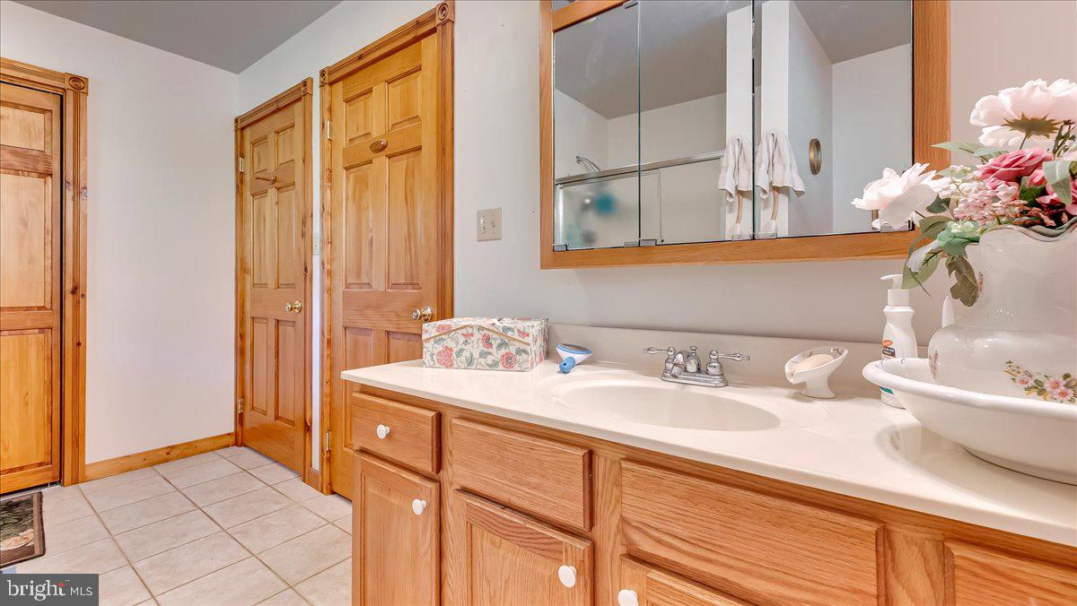 172 Golf Course Road Sugarloaf, PA 18249 - Photo 13 of 23 a bathroom with a sink double vanity and a mirror