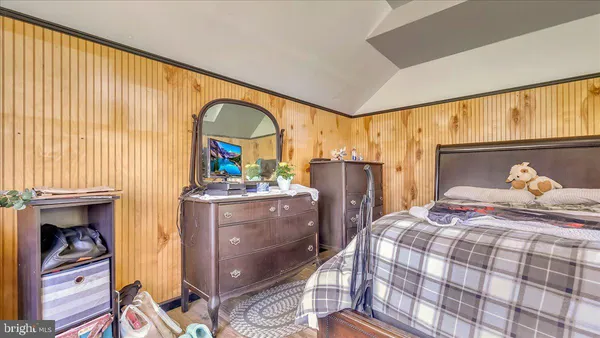 a bedroom with two beds and painted walls