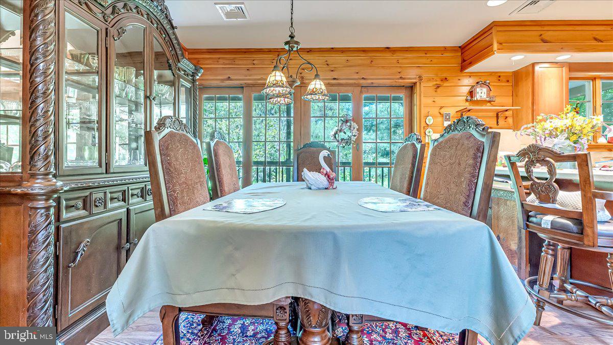172 Golf Course Road Sugarloaf, PA 18249 - Photo 4 of 23 a view of a dining room with furniture large windows and wooden floor