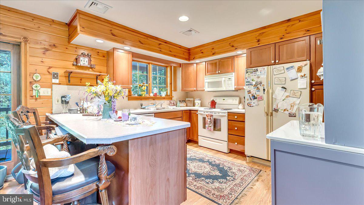 172 Golf Course Road Sugarloaf, PA 18249 - Photo 5 of 23 a kitchen with stainless steel appliances kitchen island granite countertop a table chairs and a refrigerator