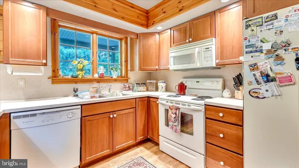 a kitchen with stainless steel appliances granite countertop a stove and a sink