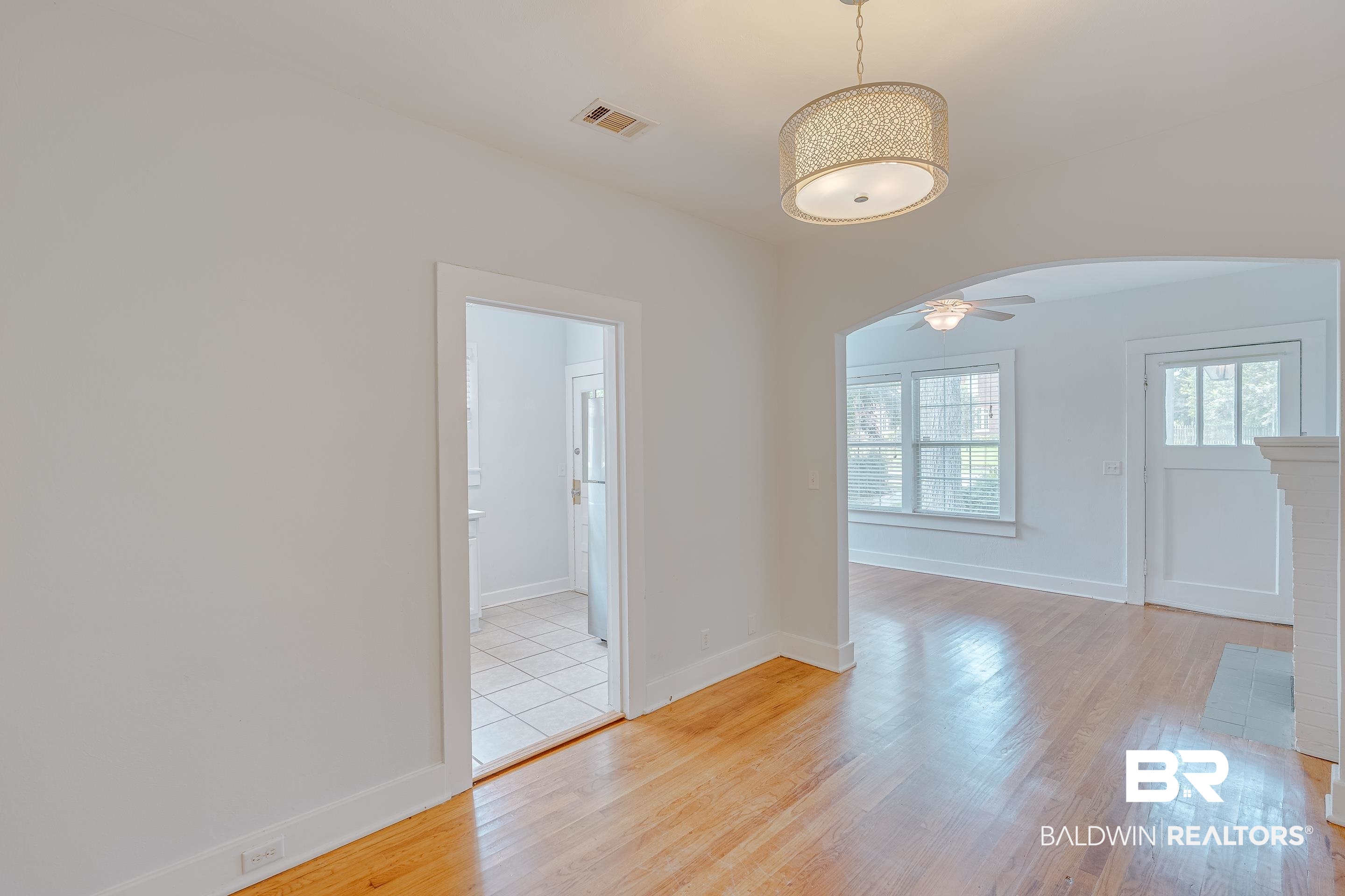 1852 Old Shell Road Mobile, AL 36607 - Photo 7 of 26 Unfurnished room featuring arched walkways and light wood finished floors