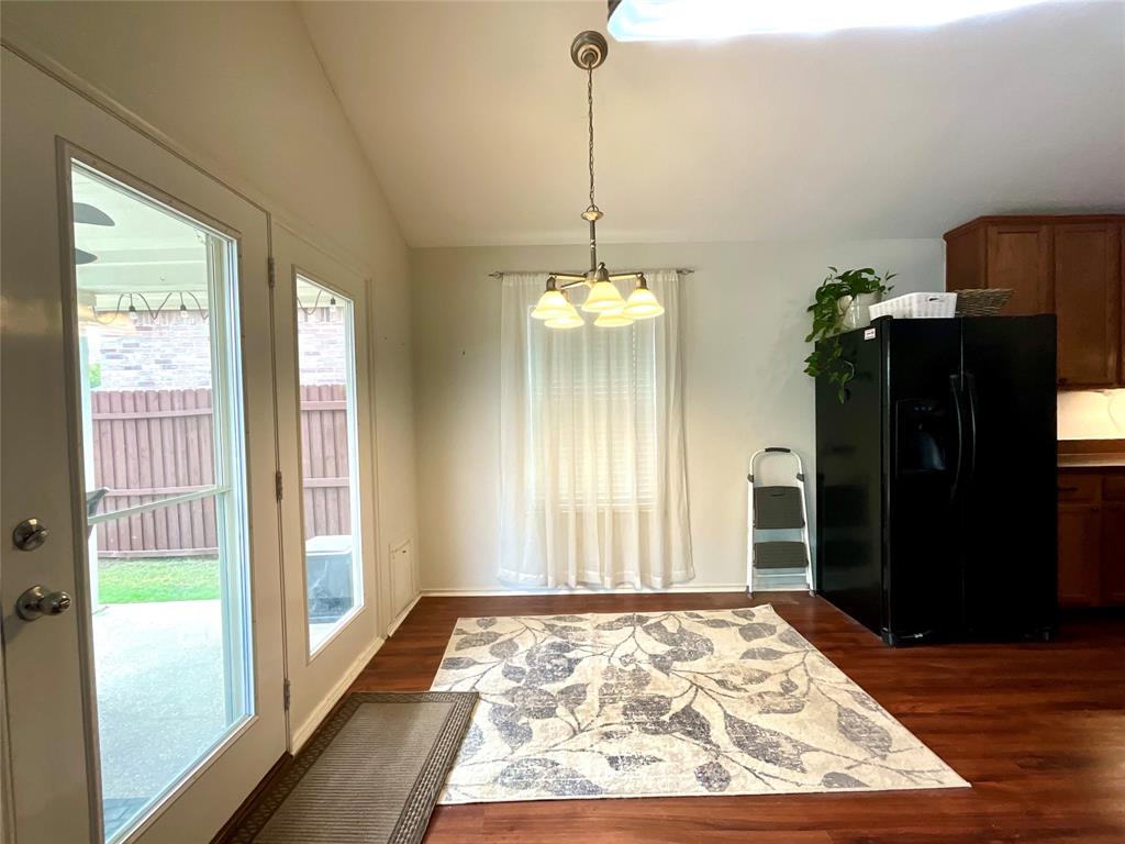 14044 Fontana Road Roanoke, TX 76262 - Photo 5 of 14 Wood-finish flooring throughout, double-pane glass French doors, and a window with sheer curtains
