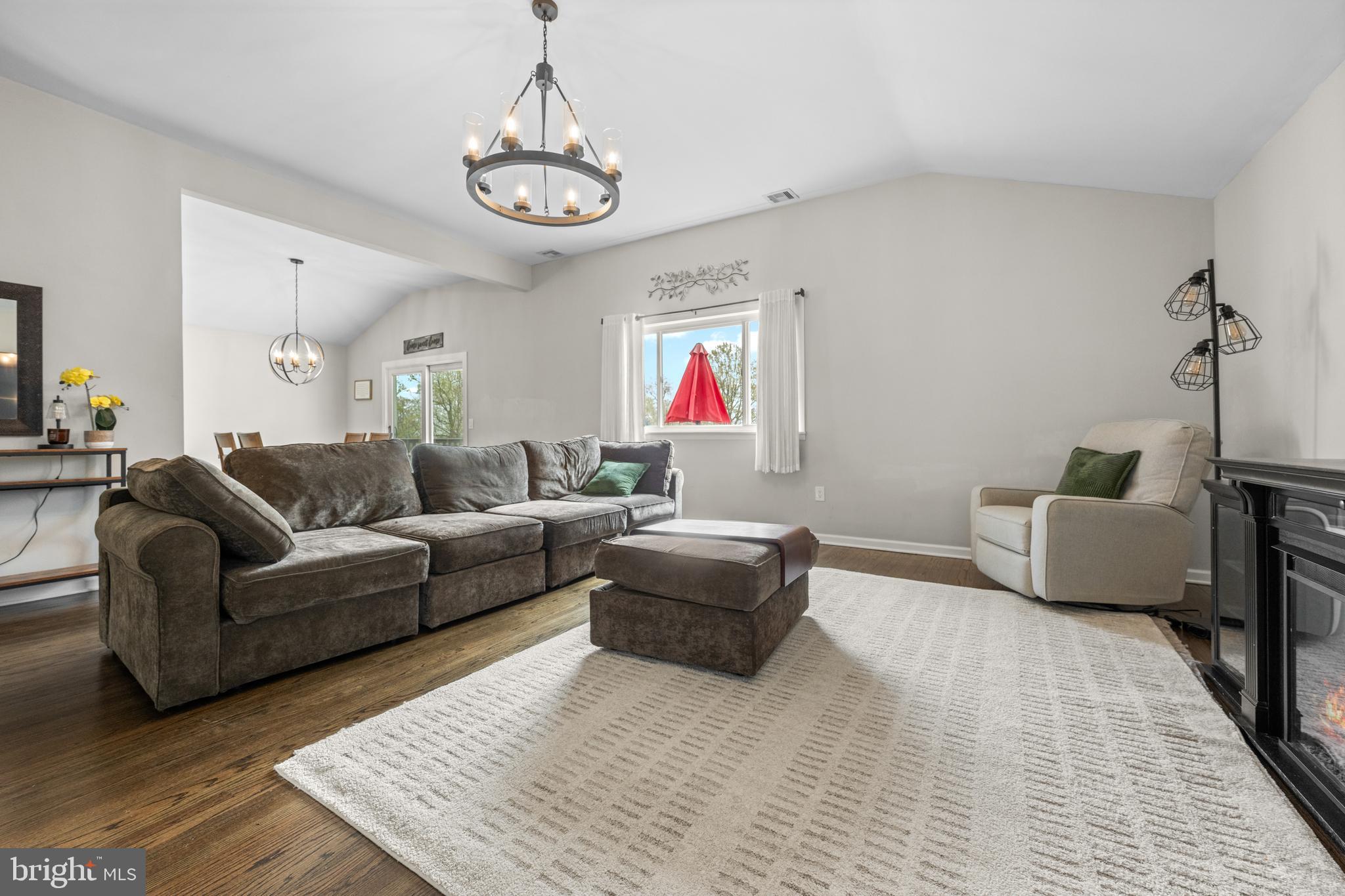 221 Hemlock Lane Springfield, PA 19064 - Photo 12 of 36 a living room with furniture and a chandelier