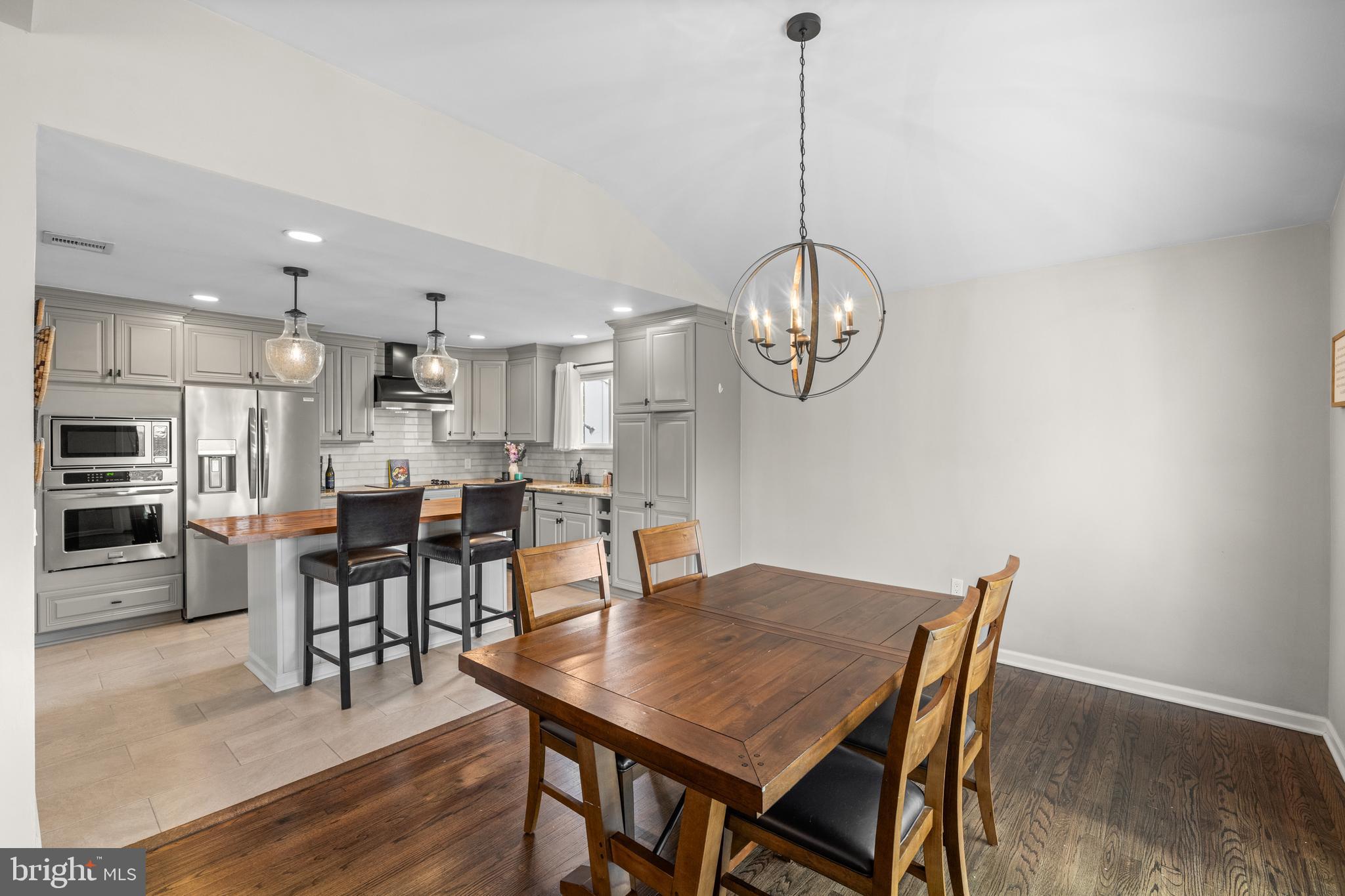 221 Hemlock Lane Springfield, PA 19064 - Photo 19 of 36 a view of a dining room with furniture and wooden floor