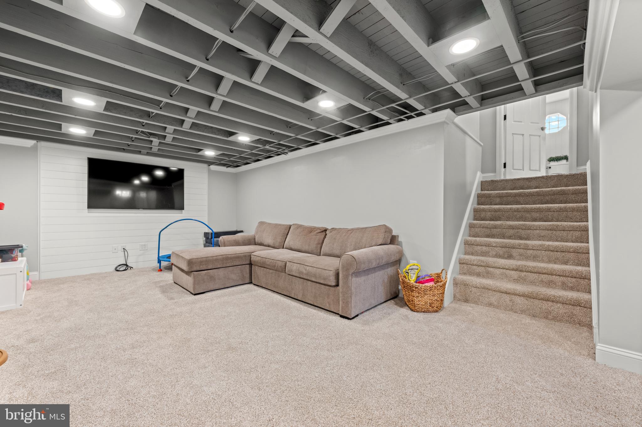 221 Hemlock Lane Springfield, PA 19064 - Photo 21 of 36 a living room with furniture and a glass door