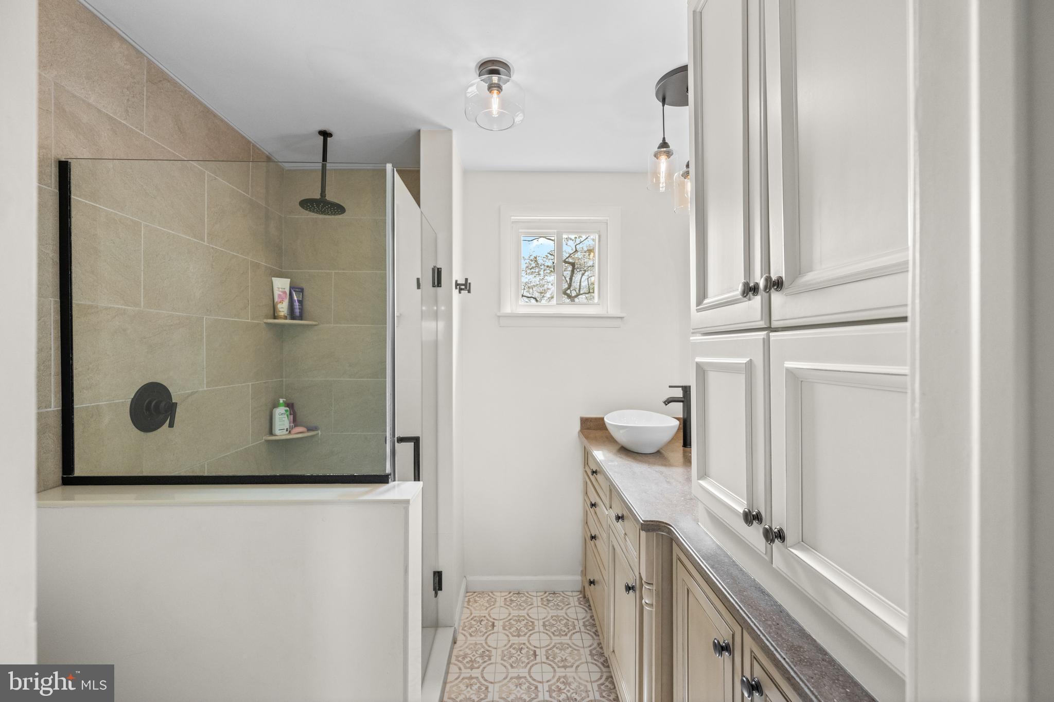 221 Hemlock Lane Springfield, PA 19064 - Photo 26 of 36 a bathroom with a granite countertop shower and a sink