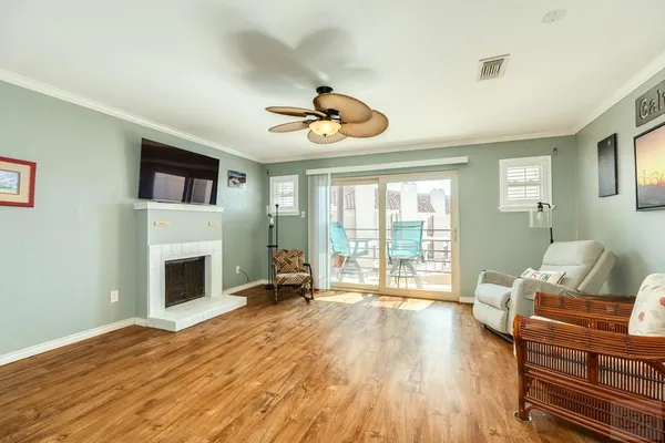 a living room with furniture fireplace and flat screen tv