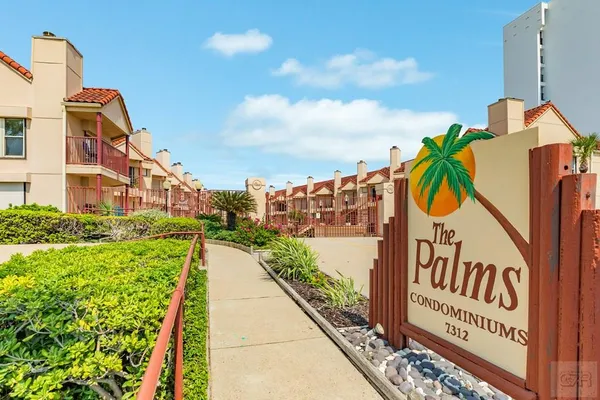 a view of a street with a building in the background