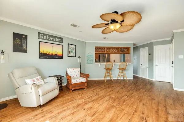 a view of a livingroom with furniture and a floor to ceiling window