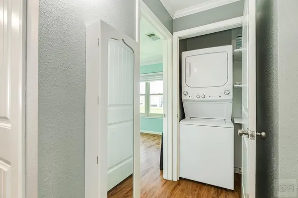 a utility room with closet dryer and washer