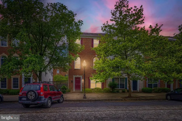 a car parked in front of a house
