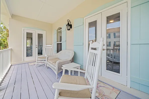 a view of a balcony with wooden floor
