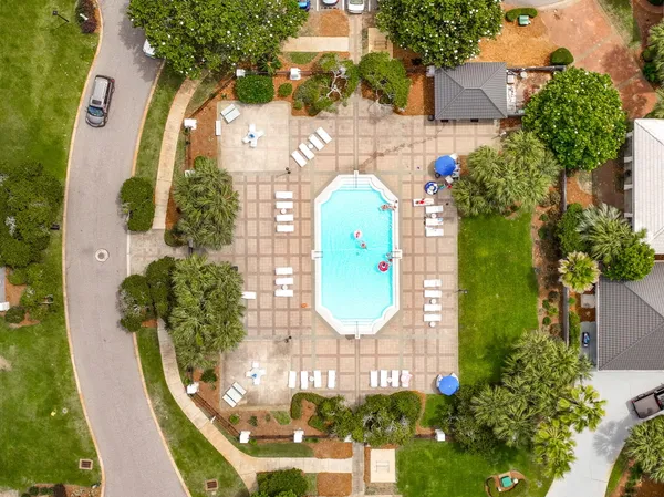 an aerial view of residential houses with city view