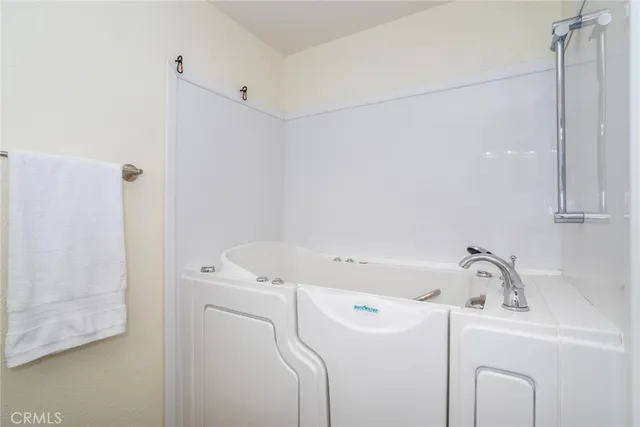 a view of a swimming pool with a yard