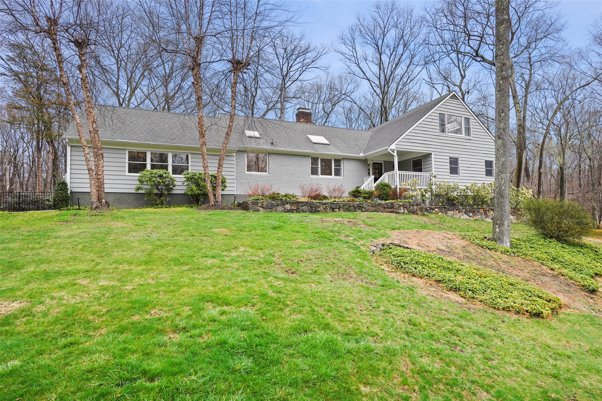 139 Brook Farm Road East Pound Ridge, NY 10576 - Photo 1 of 1 a view of a house with a big yard and large trees