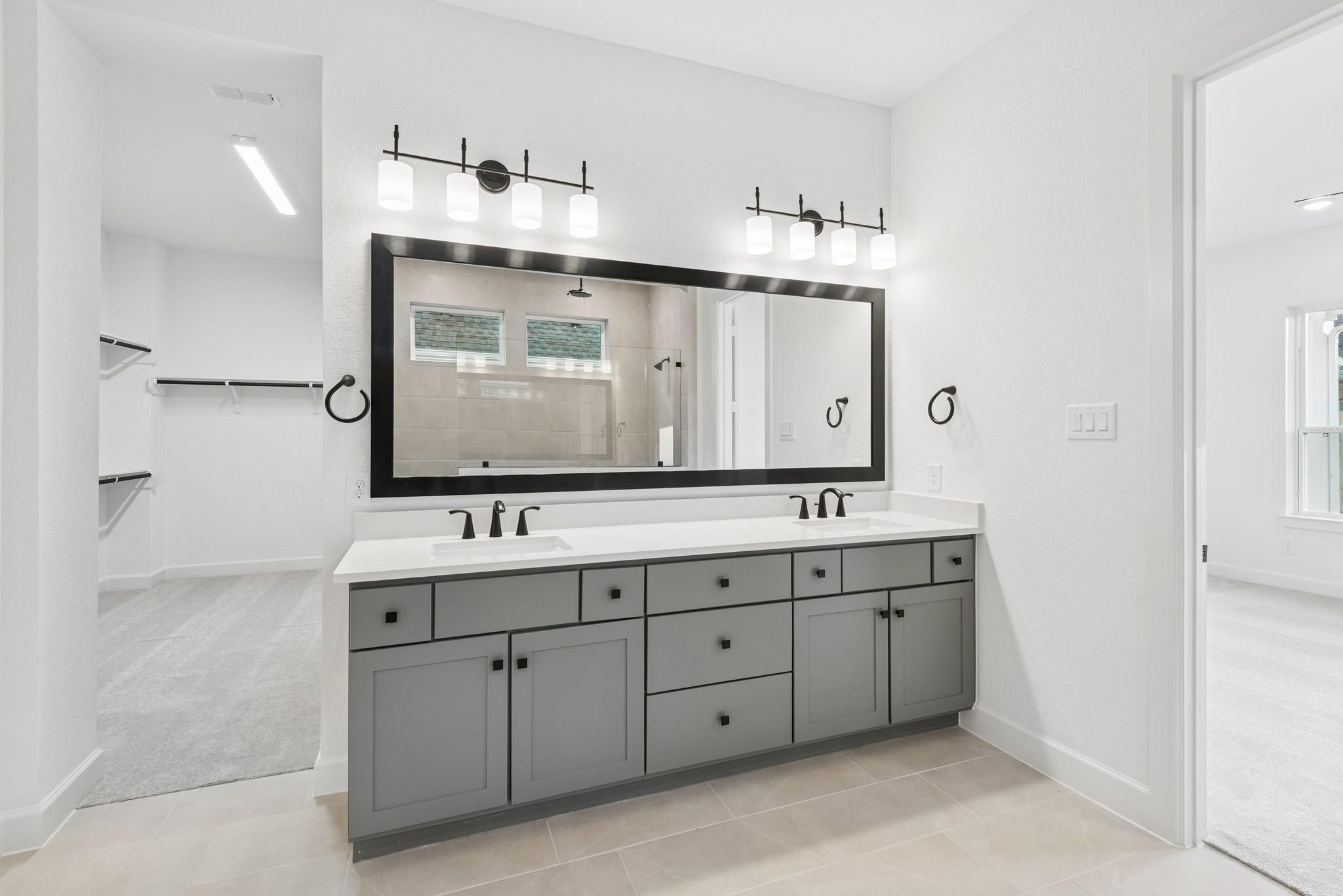 15714 Terracotta Terrace Lane Conroe, TX 77302 - Photo 38 of 47 a bathroom with a double vanity sink and mirror