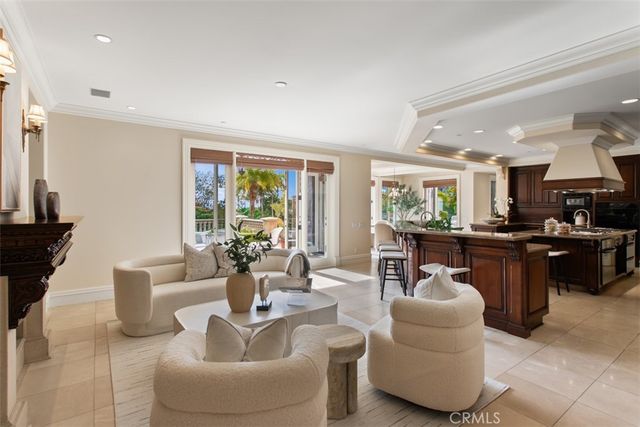 a dining room with furniture a chandelier and a rug