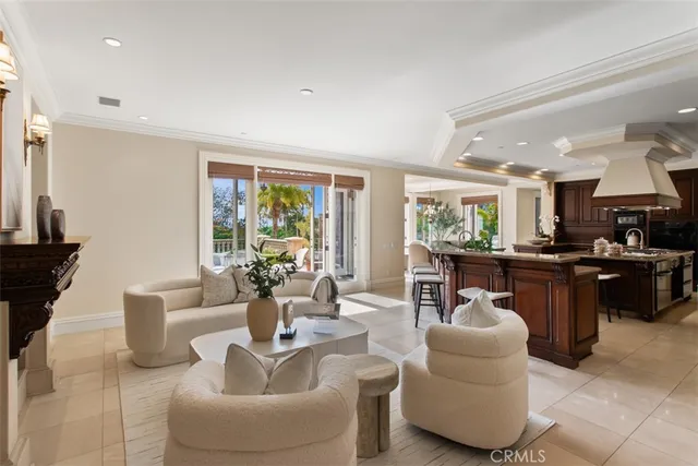 a dining room with furniture a chandelier and a rug
