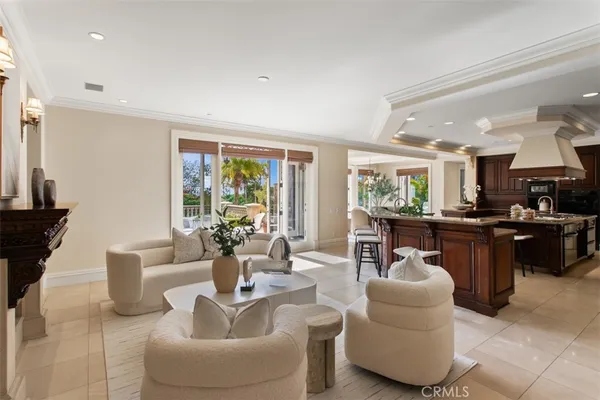 a dining room with furniture a chandelier and a rug