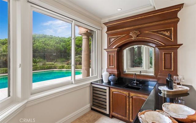 a view of a house with sitting area and garden