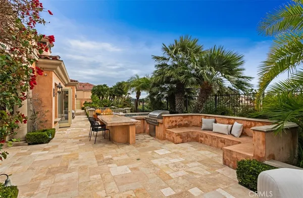 a view of a patio with couches chairs and a potted plant