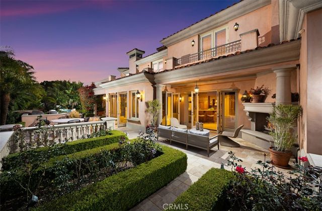 a bedroom with furniture and a large window