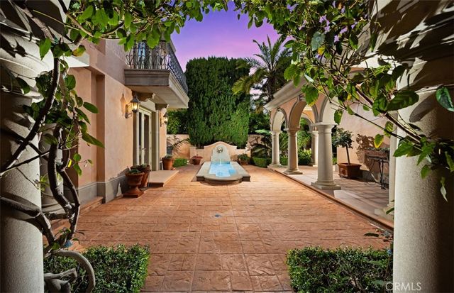 a view of a backyard with table and chairs and a fire pit
