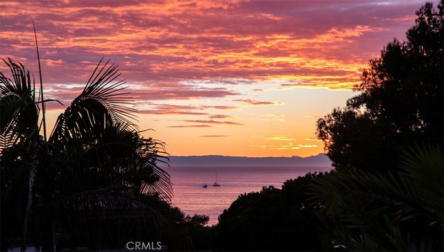 a bedroom with a bed and glass window