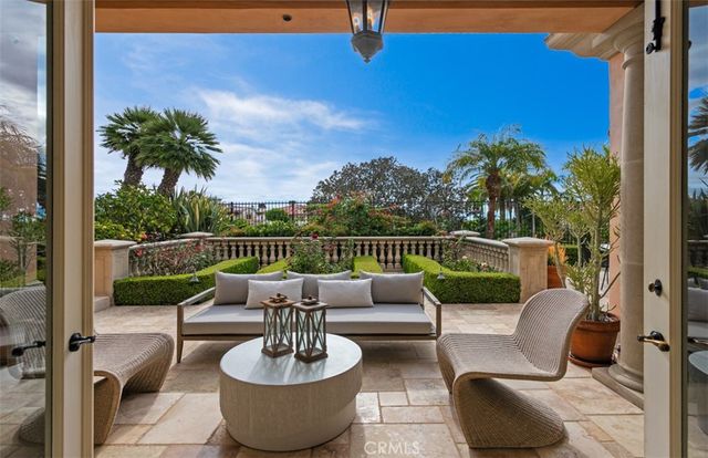 a large living room with a large tub and couches