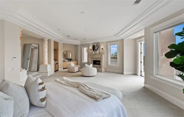 a living room with furniture and a dining table with kitchen view