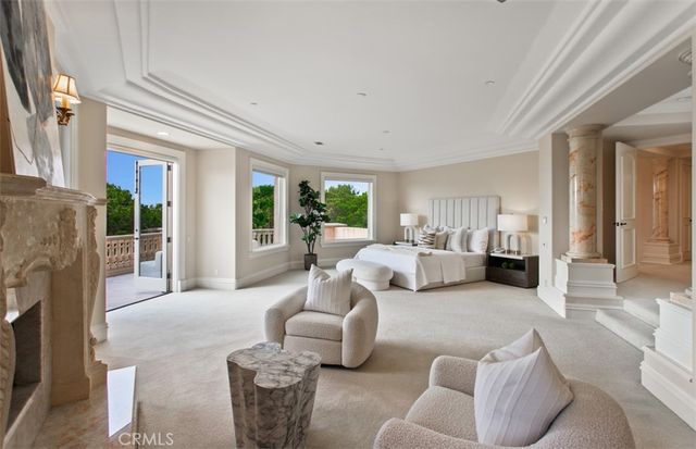 a room with pool table and windows