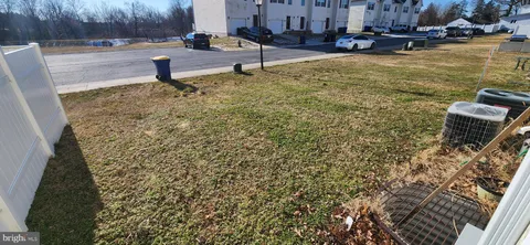 a view of a lake with chairs
