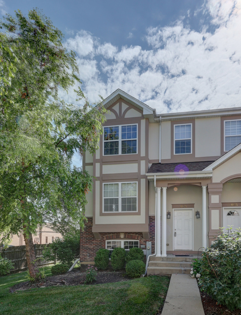 front view of a house with a yard