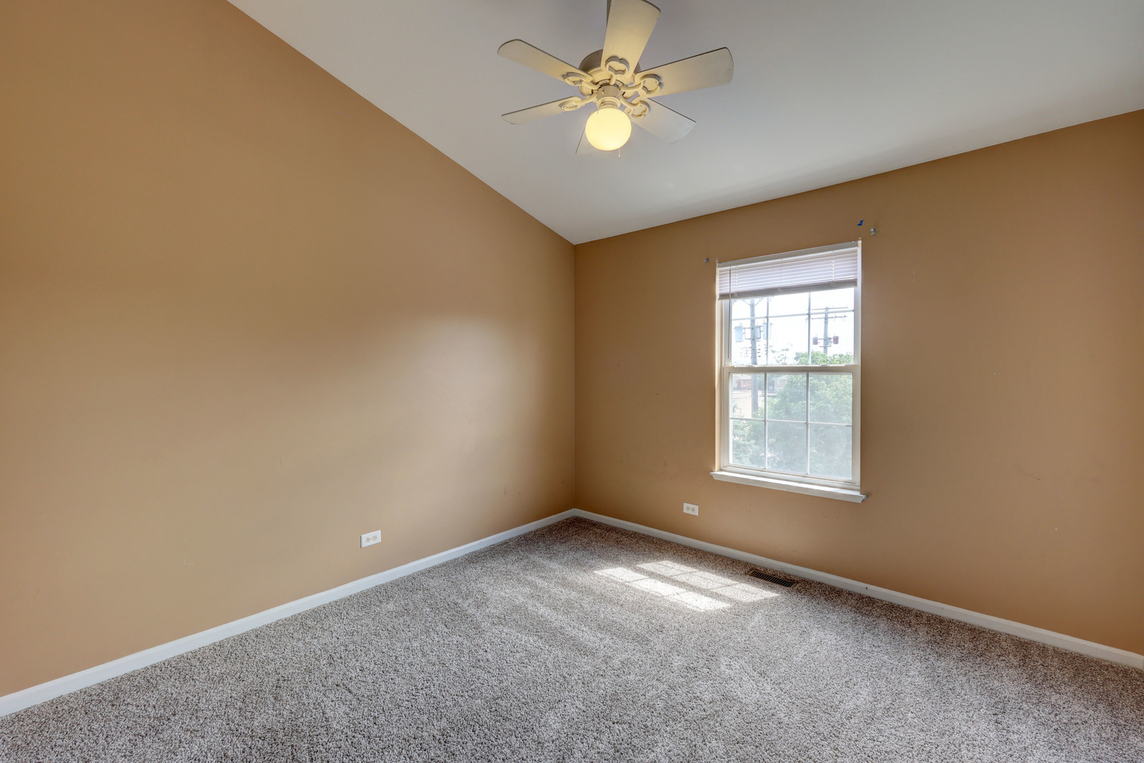 469 George Street Wood Dale, IL 60191 - Photo 14 of 24 an empty room with a window and a fan
