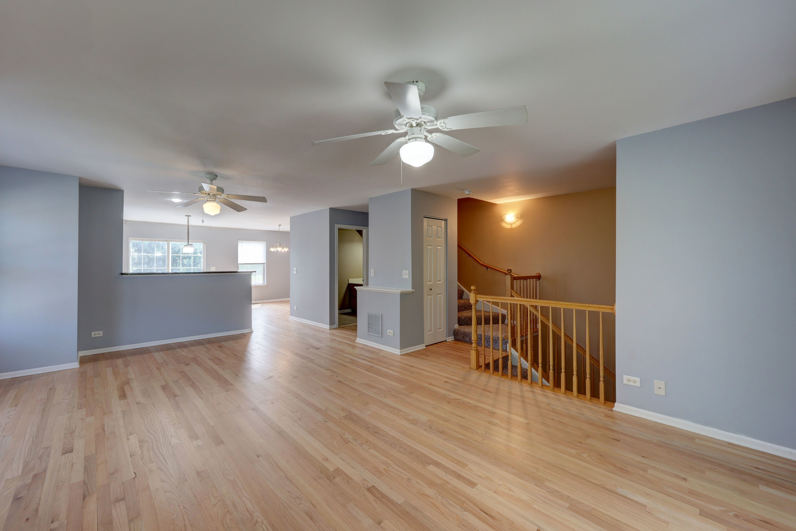 469 George Street Wood Dale, IL 60191 - Photo 2 of 24 a view of a hallway with wooden floor and a kitchen