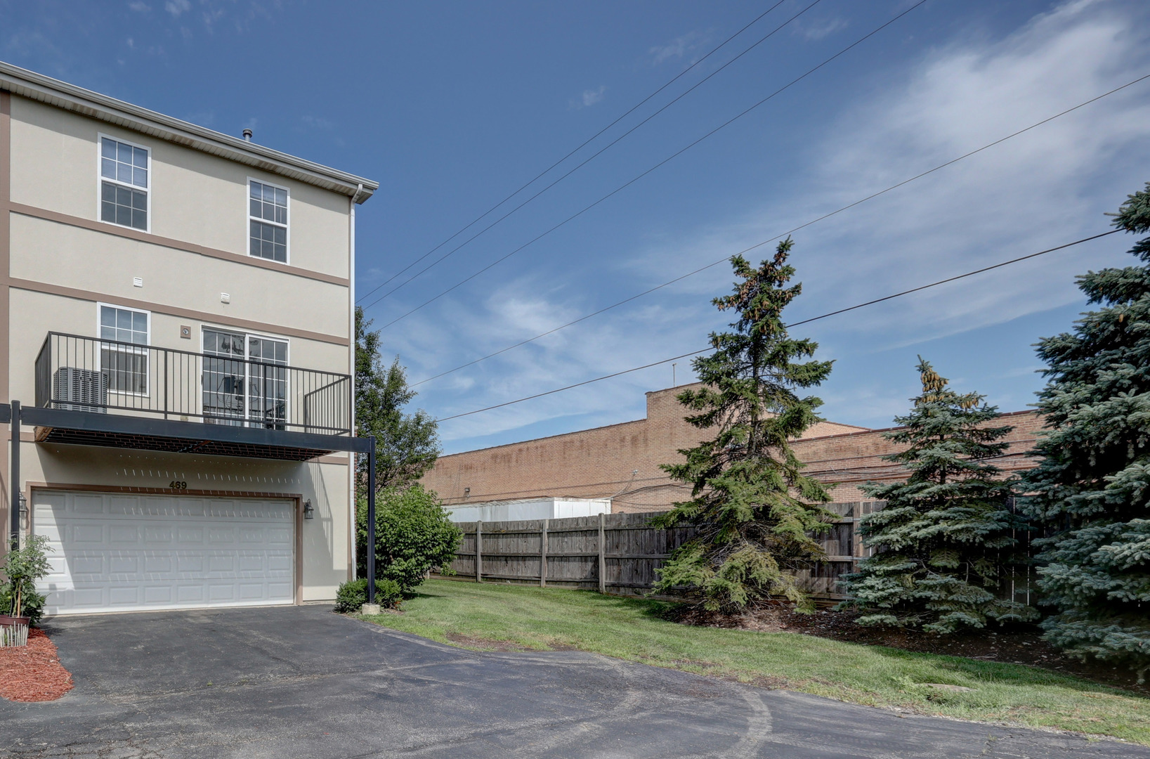 469 George Street Wood Dale, IL 60191 - Photo 23 of 24 a house that has a tree in front of it