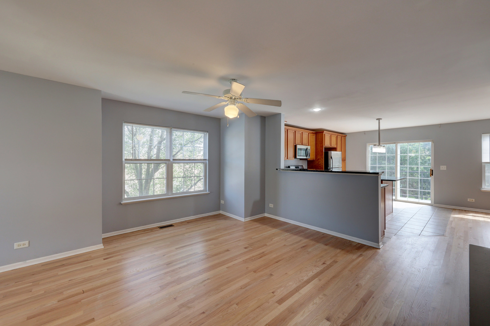 469 George Street Wood Dale, IL 60191 - Photo 5 of 24 a view of a big room with wooden floor and windows