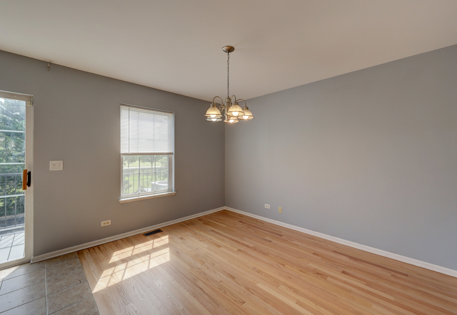 469 George Street Wood Dale, IL 60191 - Photo 9 of 24 wooden floor in an empty room with a window