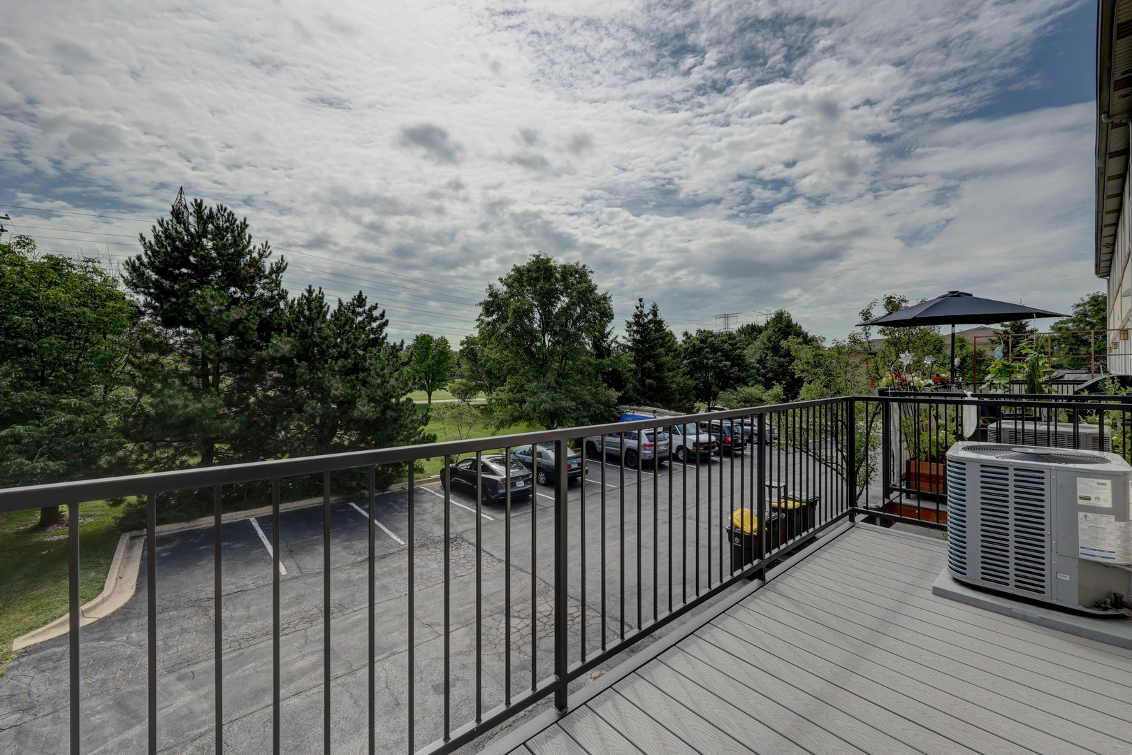 469 George Street Wood Dale, IL 60191 - Photo 10 of 24 a balcony with wooden floor and city view