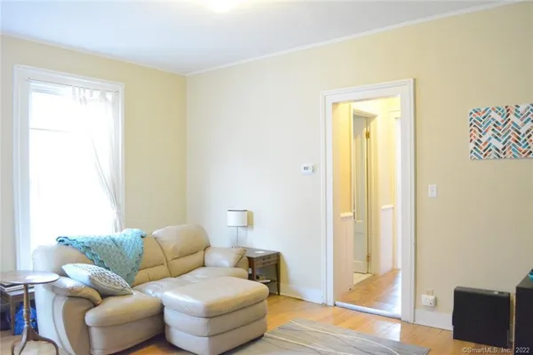 a living room with furniture and a window